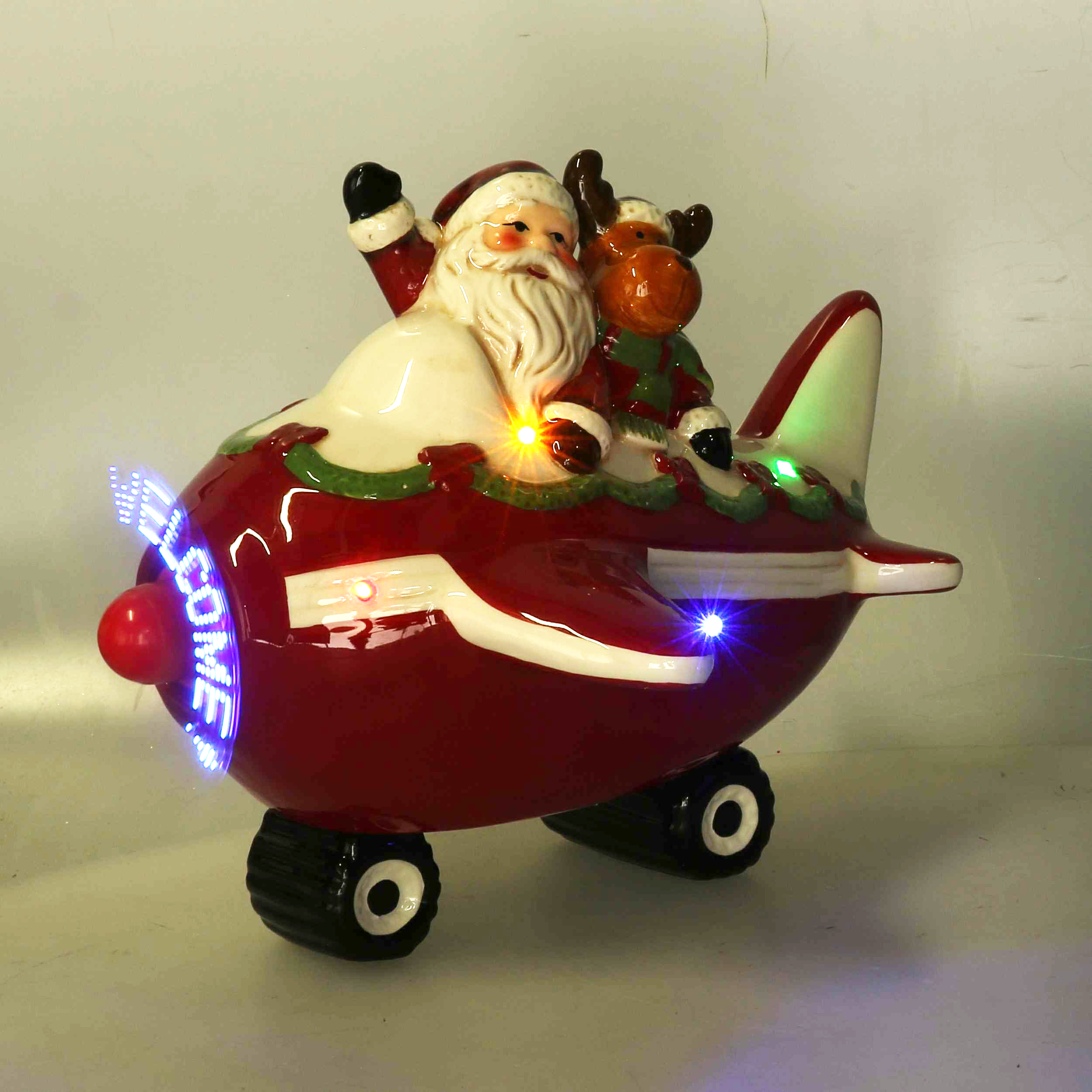BABBO CERAM. AEREO LED C/SCRITTA OLOG. L25,5 H20CM.